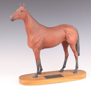 A Beswick figure of Red Rum raised on an oval wooden base 31cm h 