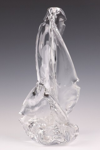A mid-century clear glass lamp base of free form 