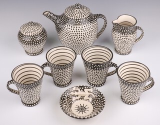 A Lincoln Kirby Bell for Newlyn Pottery, Cornwall, 8 piece Art Pottery coffee service dated 2009 comprising coffee pot, milk jug, lidded sugar bowl, circular bowl decorated a lizard and 4 mugs with polka dot and line decoration 