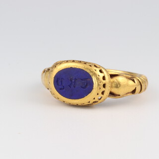 A yellow gold, testing as 18ct, lapis lazuli ring with fancy shank and engraved monogram, size M, 9.1 grams 