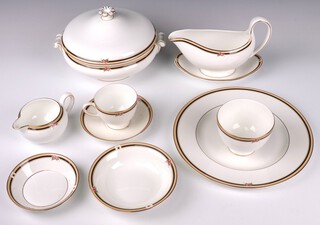A 39 piece Wedgwood Clio pattern dinner/tea service comprising 2 tureens and covers, 8 dinner plates, 8 tea plates, 8 pudding bowls, sauce boat and stand, 4 cups, 4 saucers, sugar bowl, cream jug, small circular dish together with 8 Clio plates (different pattern) 