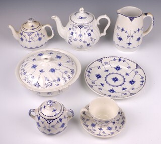 A 78 piece Myott Finlanda pattern dinner/tea service comprising 2 tureens and covers (1 base a/f), 2 oval meat plates, sauce boat, 2 stands (1 stand cracked), circular platter, 12 meat plates (7 cracked), 2 side plates (cracked), 8 soup bowls (6 cracked), 2 circular bowls, 2 pudding bowls (cracked), 7 tea plates (5 cracked), teapot (finial cracked), 15 tea cups (8 cracked), 21 saucers (4 cracked)  together with 9 similar pieces by Johnson Teaware - jug, teapot, 4 side plates, 2 bowls and a cream jug, 2 similar Churchill dinner plates, 2 similar Masons Denmark side plates and a sugar bowl and cover and 11 similar pieces marked Made in England - 4 dinner plates, 3 side plates, 2 saucers and a pudding bowl 