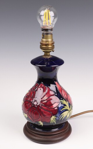 A contemporary Moorcroft table lamp decorated with flowers 20cm 
