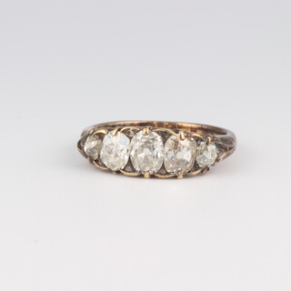 An yellow gold, testing as 14ct, 5 stone mine cut diamond ring, 1.2ct, size K, 3 grams