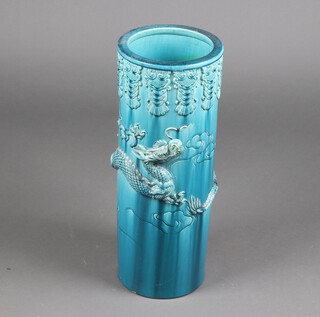 An early 20th Century Chinese turquoise glazed circular stick stand decorated with a dragon 60cm 