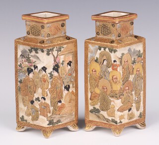 A pair of early 20th Century Japanese Satsuma vases decorated with panels of figures on scroll feet with seal mark 14cm 