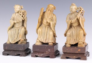 A set of 3 20th Century Chinese carved soapstone figures of deities 17cm 