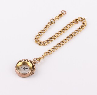 A 9ct yellow gold bracelet with a 9ct mounted compass, 18cm 