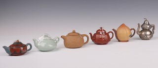 A Chinese white metal gourd shaped teapot with dragon handle 9cm and 5 miniature ceramic teapots 