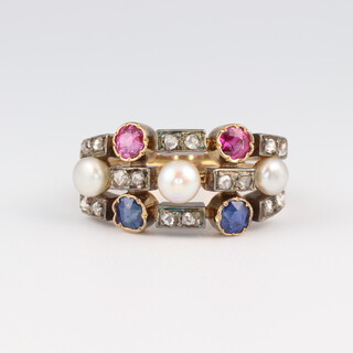 A 19th Century, yellow gold, testing as 18ct, 3 section ring, comprising rubies, sapphires, diamonds and seed pearls, the rubies 0.20ct, sapphires 0.20ct, diamonds 0.50ct, the pearls 3mm each, size J, 4.1 grams 