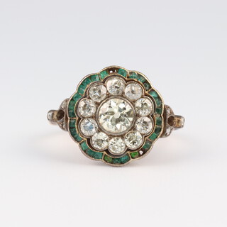 A yellow gold, testing as 14ct, diamond and emerald cluster ring, the brilliant cut diamonds 1.5ct, the Princess cut emeralds approx. 0.25ct (2 missing and 6 chipped), size J, 4.7 grams 
