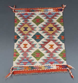 A yellow, green and white ground Chobi Kilim rug with all over diamond designs 92cm x 59cm 