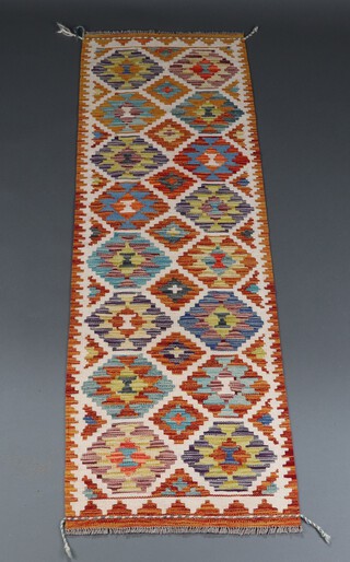 A white blue and tan ground Chobi Kilim runner with all over diamond design 207cm x 63cm 