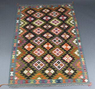 A green, black and orange ground Maimana Kilim rug with overall diamond designs 198cm x 131cm  