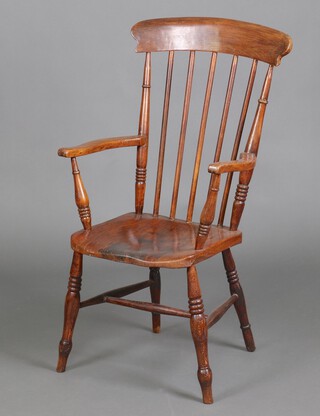 A 19th Century beech and elm Windsor stick back carver chair with solid seat, raised on turned supports with H framed stretcher 109cm h x 56cm w x 43cm d (seat 25cm x 31cm) 