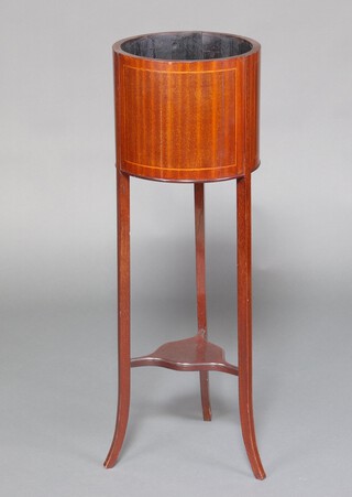 An Edwardian circular inlaid mahogany jardiniere stand with undertier, raised on outswept supports 95cm h x 32cm diam. 