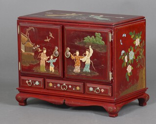 A 20th Century Chinese lacquered table top cabinet, fitted 6 drawers enclosed. by a pair of panelled doors, the base fitted 3 drawers, raised on bracket feet, decorated with floral panels and and figures 27cm h x 34cm w x 20cm d 