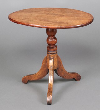 A 19th Century oval mahogany snap top wine table, raised on pillar and tripod base 53cm h x 57cm x 44cm