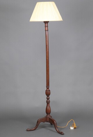 An Edwardian octagonal carved mahogany standard lamp, raised on a pillar and tripod base with egg and claw feet 158cm h x 52cm 