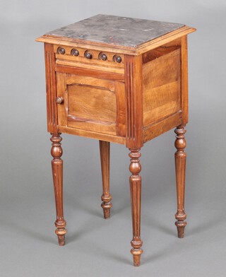 A 19th Century French carved walnut bedside cabinet with grey veined marble top, fitted a drawer above cupboard enclosed by a panelled door, raised on turned and fluted supports 83cm h x 43cm w x 39cm d 