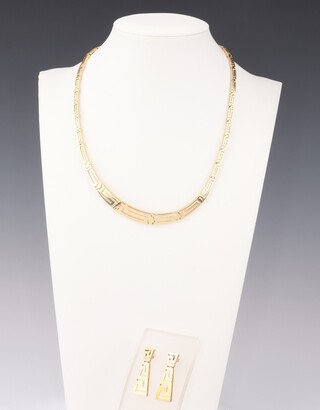 A 14ct yellow gold Greek key pattern tapered necklace 38cm with ensuite ear studs, 20.9 grams 