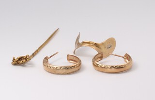 A pair of 9ct yellow gold hoop earrings, a tie pin and a mount, gross weight 3.9 grams 