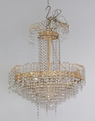 A circular 7 tier gilt metal and cut glass electrolier hung cut glass lozenges 122cm h x 53cm diam. 
