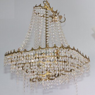 A 6 tier circular gilt metal and glass electrolier 54cm h x 60cm diam.  