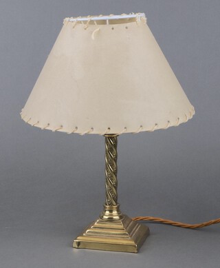 A brass table lamp with Corinthian column capital and spiral column, raised on a stepped base 20cm h x 9cm w x 9cm d 