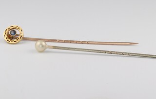 An Edwardian 15ct yellow gold sapphire tie pin 1.1 grams and a steel pearl ditto 