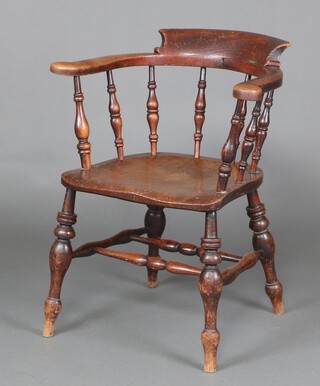 A 19th Century elm smokers bow armchair with spindle back and solid elm seat, raised on turned supports with double H framed stretcher 77cm h x 63cm w x 46cm (seat 26cm x 29cm) 