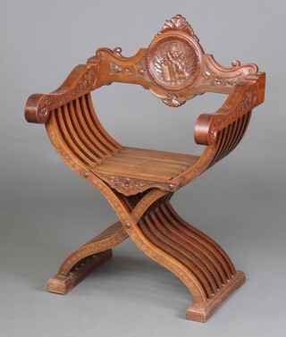 A 19th Century Italian carved walnut Savanorola bar back folding chair, the bar back carved St Mark's Lion, and carved harebells to the arms, raised on X framed supports 91cm h x 64cm w x 52cm d (seat 26cm x 26cm) 