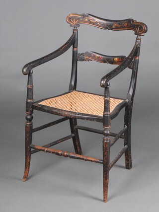 A 19th Century black lacquered bar back open arm chair with carved mid rail, the bar back decorated a pagoda, birds and fruit, the mid rail decorated fruit, having a woven cane seat 88cm h x 46cm x 32cm 