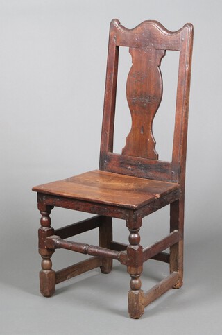 An early 18th Century Irish? oak slat back chair with vase splat and solid seat, raised on turned and block supports 99cm h x 46cm w x 38cm d 