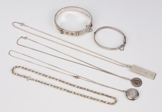 A silver bangle, a silver ingot pendant on chain and other items of silver costume jewellery, 76 grams 