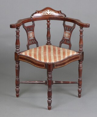 An Edwardian inlaid corner chair with turned columns and pierced slat back, raised on turned supports with H framed stretcher 73cm h 