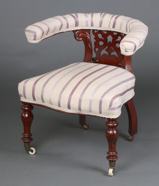 A 19th Century mahogany tub back chair with pierced  slat back, the seat of serpentine outline, raised on turned supports 70cm h x 67cm w x 48cm d 
