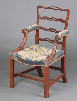 A Georgian mahogany London ladder back open arm chair, the seat and arms upholstered, the front of the arms with tracery and floral carving, raised on square supports 92cm h x 54cm w x 46cm (seat 20cm x 29cm) 