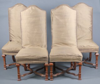 A set of 4 Queen Anne style high back dining chairs upholstered in green floral silk (and with brown loose covers), raised on square tapered supports with X framed stretchers 127cm h x 56cm w x 46cm d.  These chairs were previously used in the Fortnum and Mason boardroom and were made by the After Noah workshop in 2017-2018 to match chairs originally purchased in the 1920's 