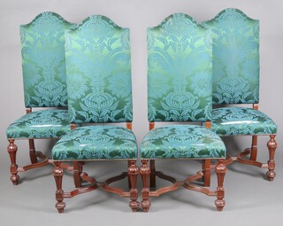 A set of 21 beech framed Queen Anne style high back dining chairs, the seats and backs upholstered in green silk, raised on square tapered supports with X framed stretchers 127cm h x 56cm w x 46cm d  (seats 30cm x 27cm).  These chairs were previously used in the Fortnum and Mason boardroom and were made by the After Noah workshop in 2017-2018 to match chairs originally purchased in the 1920's