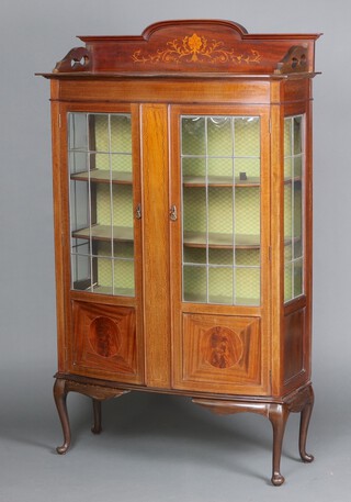 An Edwardian Art Nouveau inlaid mahogany display cabinet with raised back, fitted shelves enclosed by lead glazed panelled doors, raised on cabriole supports 180cm h x 109cm w x 37cm d,