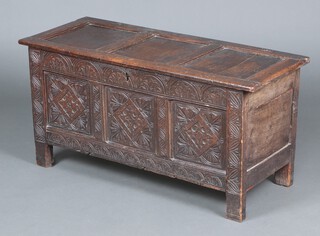 A 17th Century carved oak coffer of panelled construction with hinged lid, the front with arcaded decoration and iron lock 83cm h x 110 w x 45cm d 