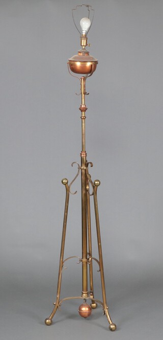 A copper and brass adjustable standard oil lamp, converted for use as an electric standard lamp 157cm h 