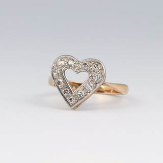 An 18ct yellow gold diamond set heart ring, set with brilliant cut diamonds approx. 0.10ct, size K, 2.9 grams 