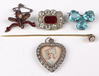 A silver paste set heart portrait pendant, a diamond tie pin 0.20ct and minor brooches 