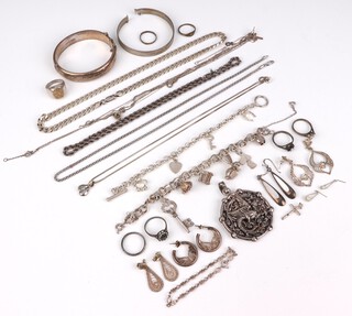An engraved silver bangle and other items of silver costume jewellery, gross weight 194 grams 