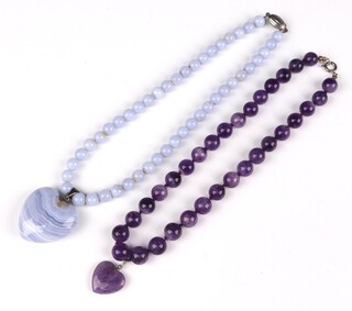 An amethyst bead necklace with heart pendant 40cm and a lace agate ditto 40cm 