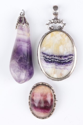 A silver mounted Blue John pendant 45mm, a ditto brooch 20mm and an amethyst pendant 