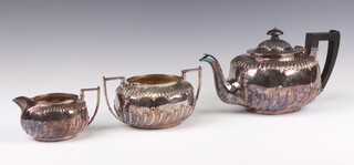 A Victorian silver 3 piece tea set with demi fluted decoration and ebony mounts, London 1892, gross weight 946 grams