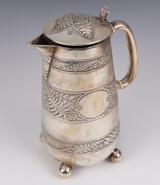 A Victorian silver hot water jug with engraved Cymric decoration, ivory resistors and scroll thumb piece, on ball feet, Sheffield 1872, maker Fenton Brothers, 20cm, 488 grams Ivory Exemption Certificate YYADPBM7